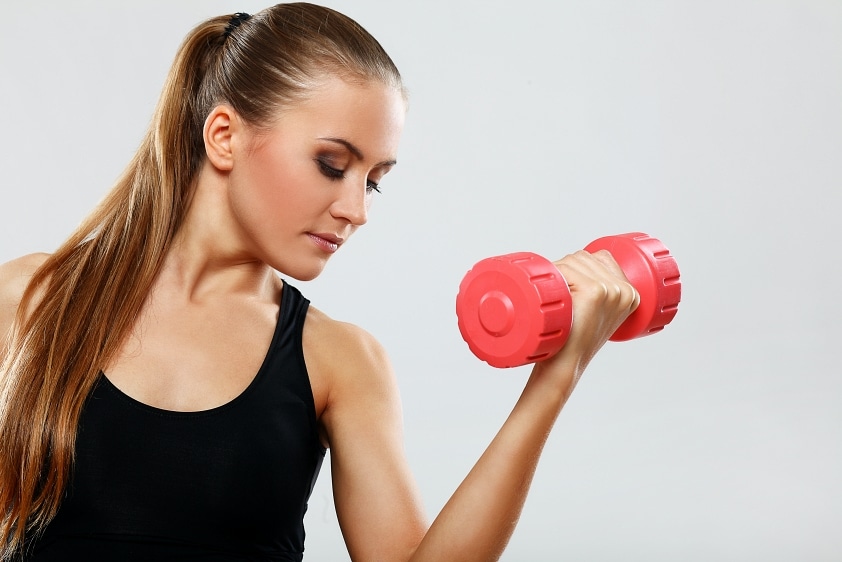 young woman with dumbells