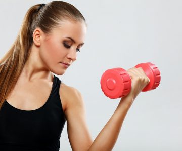 young woman with dumbells